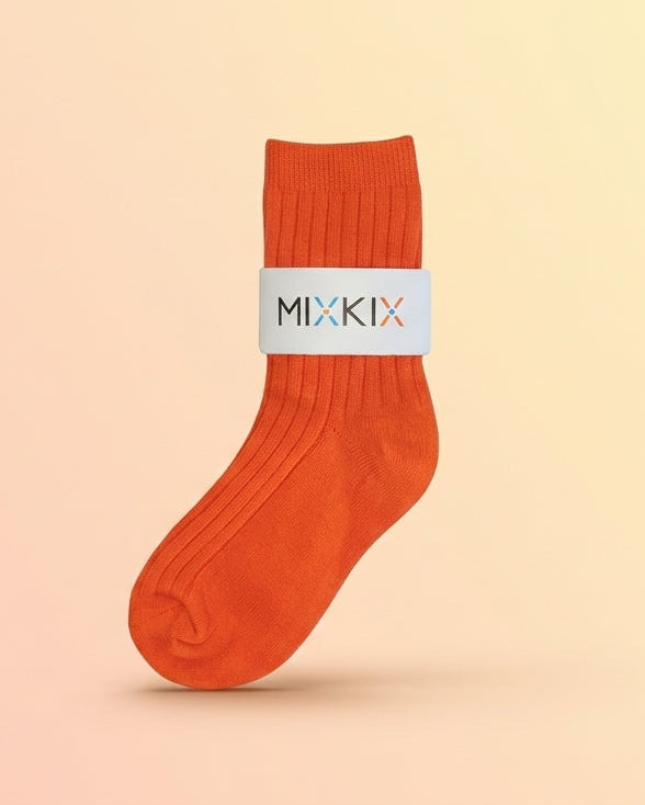 Solid colour bright orange crew sock ffor kids and toddlers in 100% cotton. 