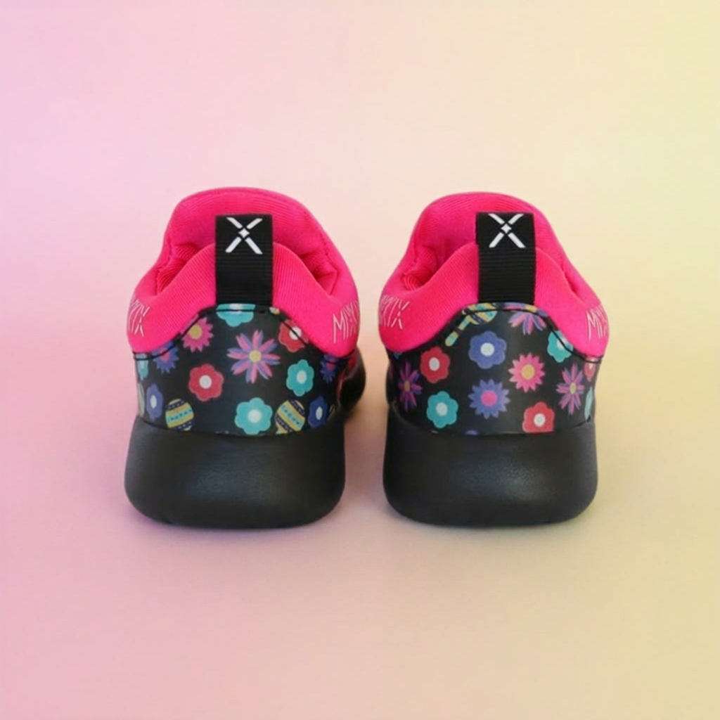 Pair of children's shoes with floral patterns on a gradient background