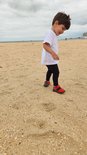 Boy with red sneakers by Mix Kix