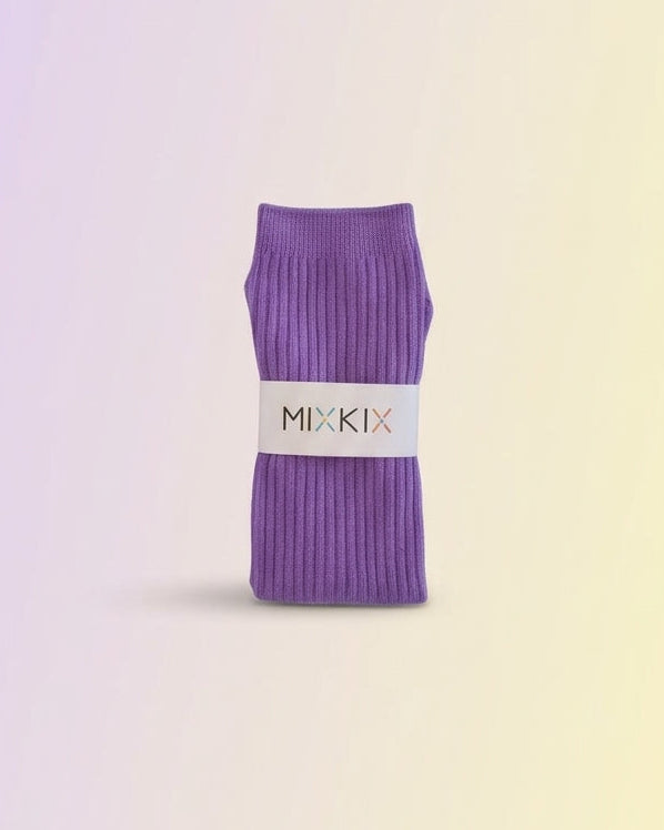 Purple ribbed slouch socks with a white paper band labeled 'MIXKIX' cotton socks for kids. 